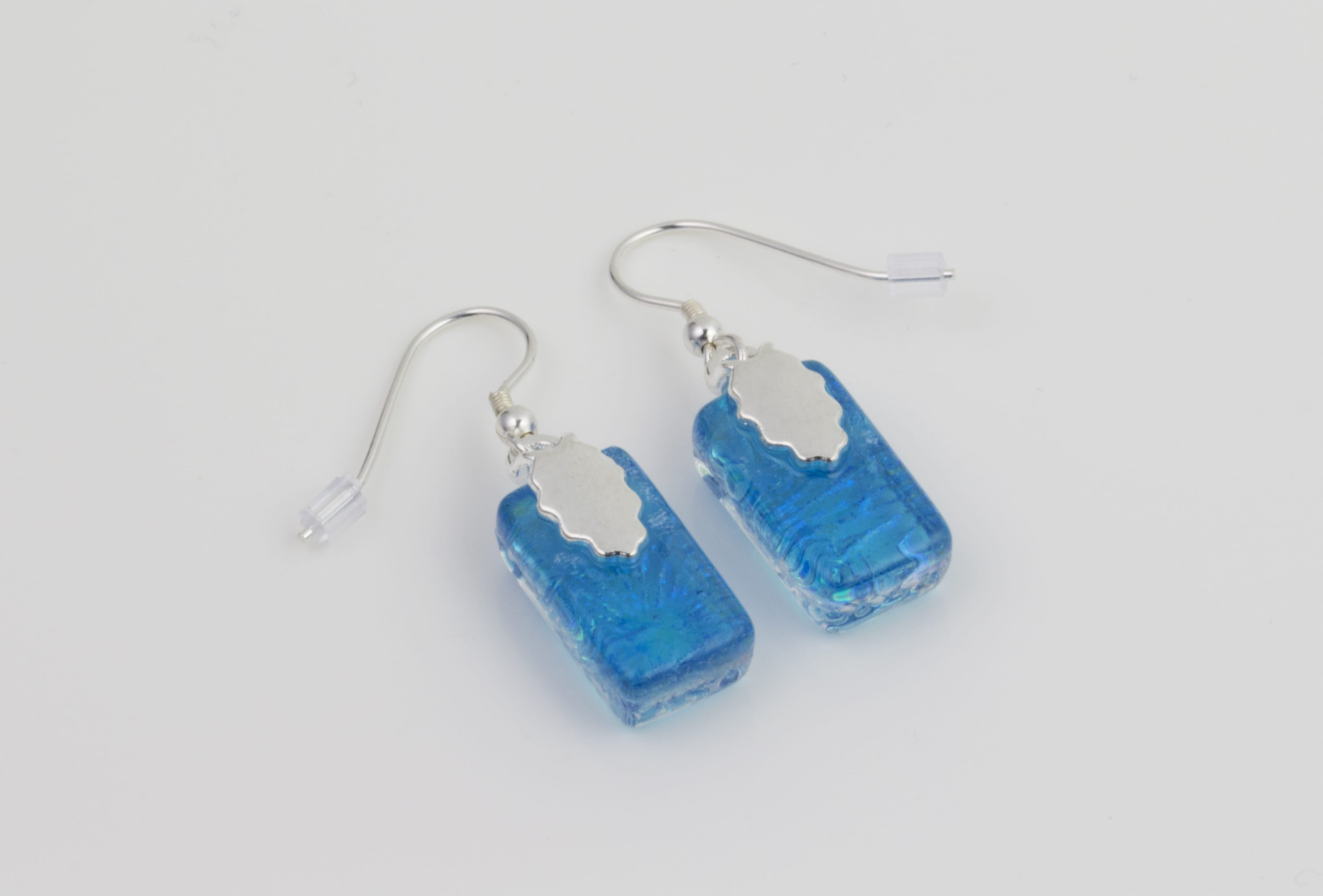 Dichroic glass jewellery, glass drop earrings, turquoise glass earrings with starburst pattern, art glass earrings, handmade in Shropshire, sterling silver hooks