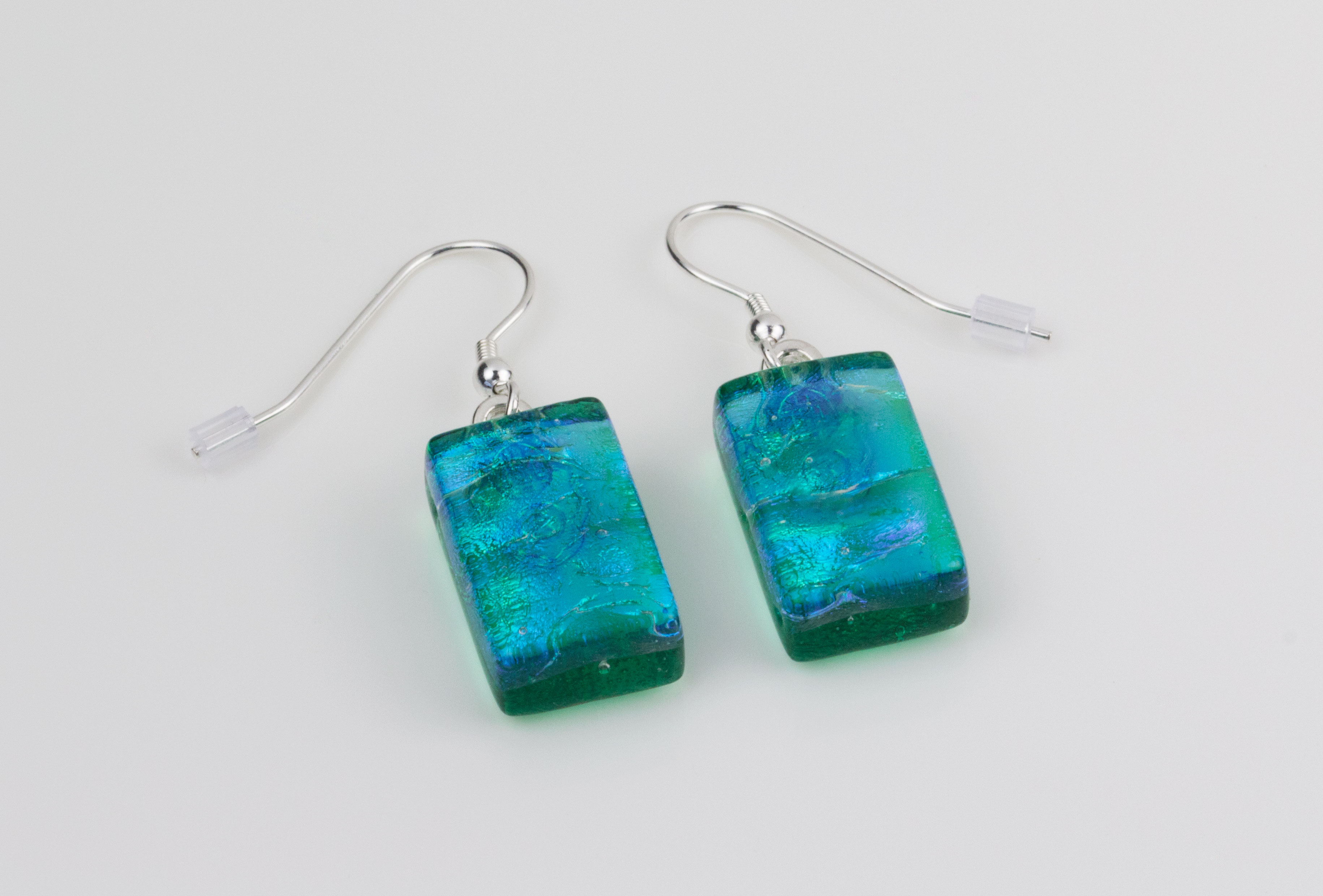 Dichroic glass jewellery, glass drop earrings, emerald green glass earrings with ripple, art glass earrings, handmade in Shropshire, sterling silver hooks