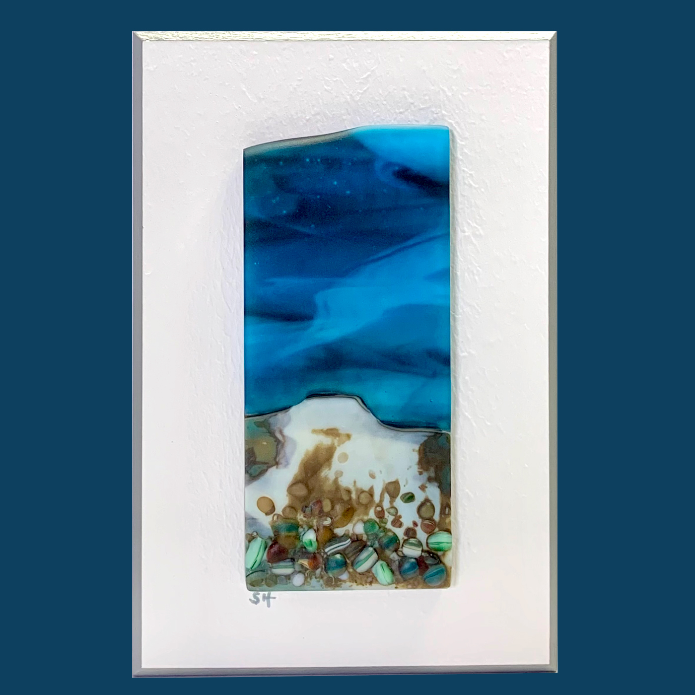 Seascapes fused glass wall art - light blue sky, vanilla/greens/brown and pale blue/cranberry pebbles in landscape.
