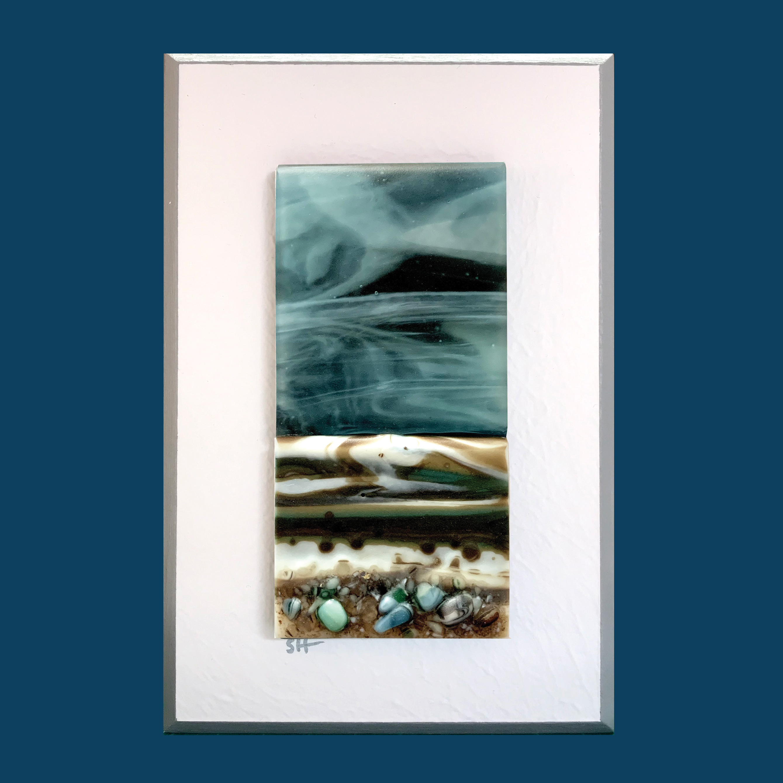 Seascapes fused glass wall art. Moody midnight blue sky, brown, white and green foreshore.Satin finish.