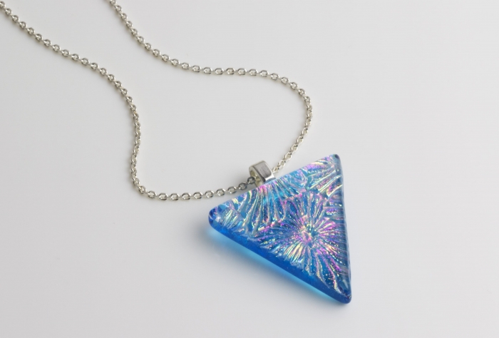A blue handmade glass jewellery uk pendant with starburst pattern