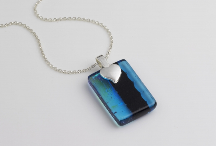 Reverse of dichroic jewellery pendant necklace in blue/green with a sterling silver chain