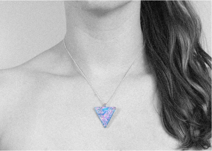 A unique Shropshire jewellery design in blue starburst patterned dichroic glass